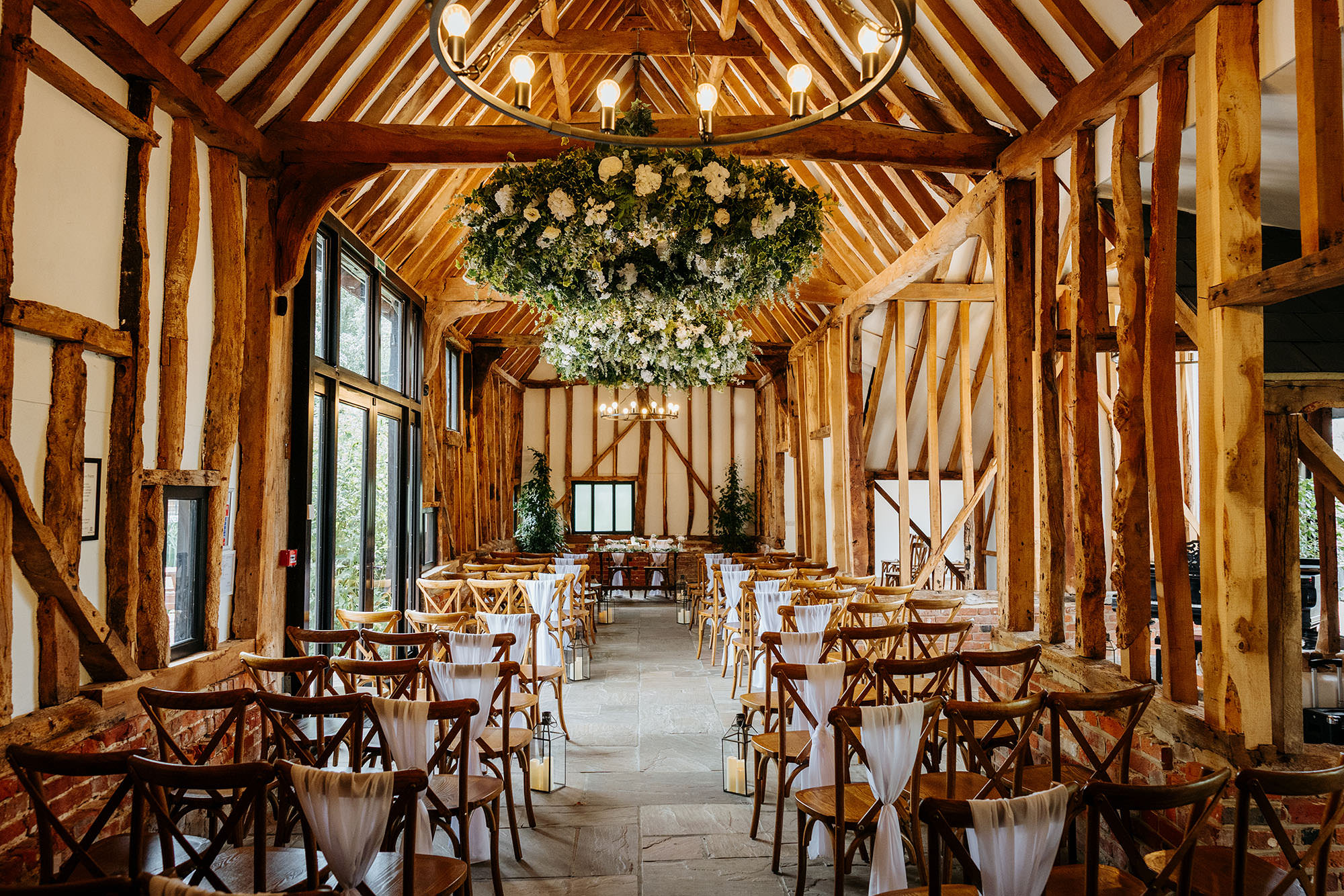 The inside of the grade 2 listed barn at High House Weddings all set up for a wedding day ceremony. 