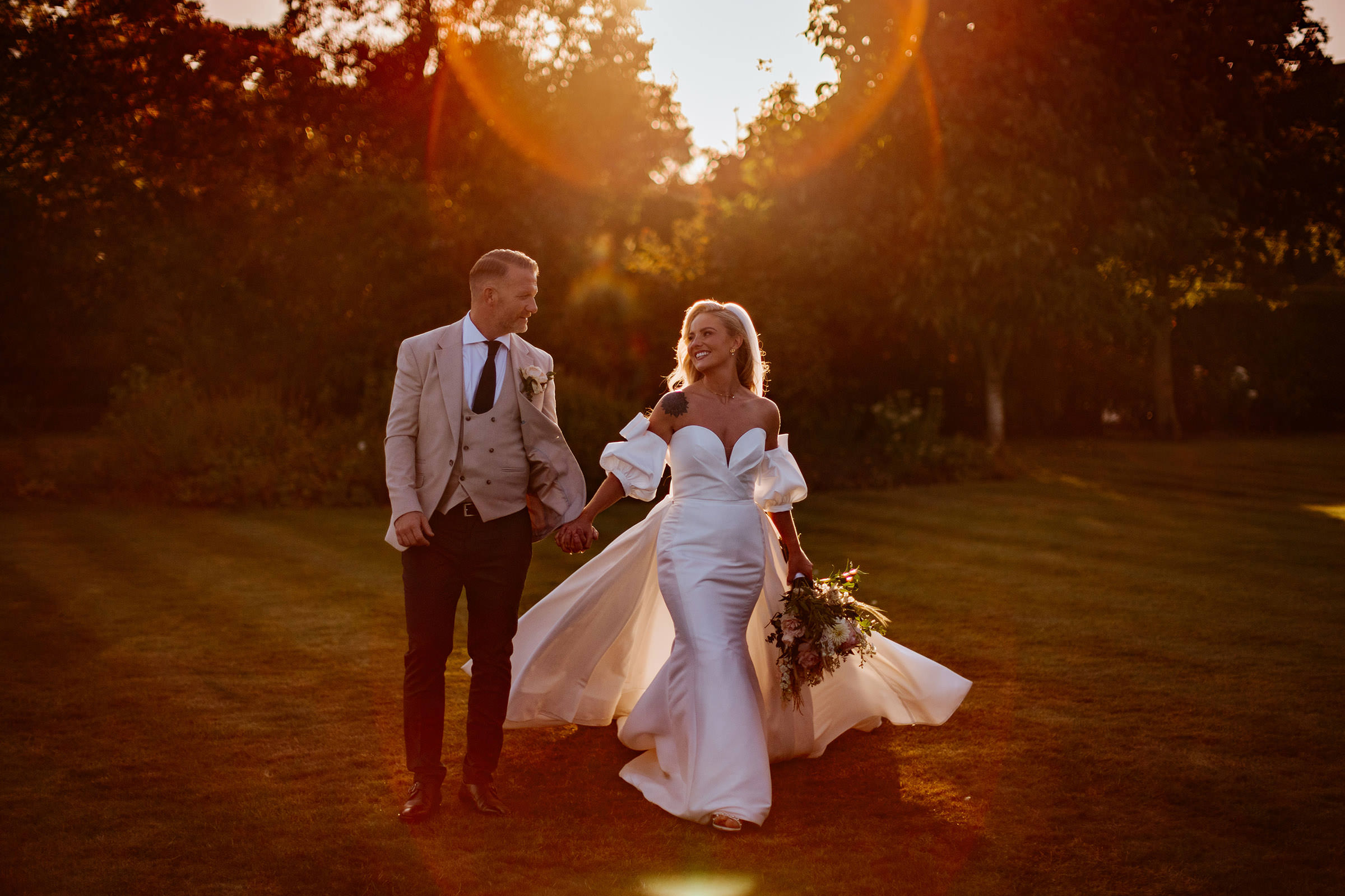 Bride and groom portraits in the gardens at High House at Golden hour